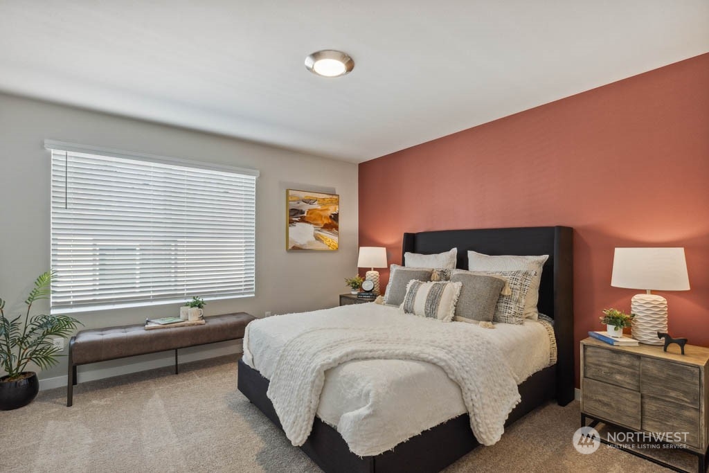 9616 19th Avenue Southeast, Unit E Everett, WA 98208 - Photo 11 of 17 a bedroom with a bed and a couch