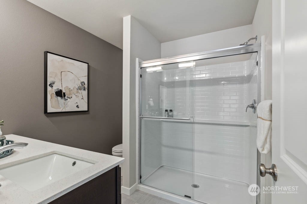 9616 19th Avenue Southeast, Unit E Everett, WA 98208 - Photo 13 of 17 a bathroom with a bathtub and a shower