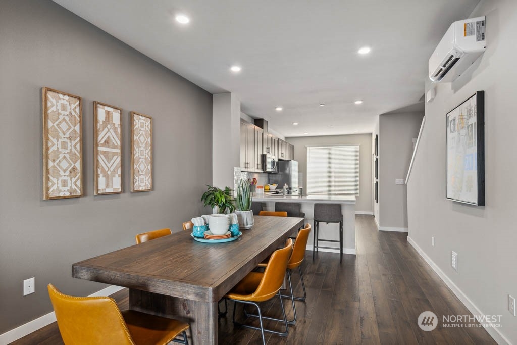 9616 19th Avenue Southeast, Unit E Everett, WA 98208 - Photo 4 of 17 a view of a dining room with furniture and wooden floor