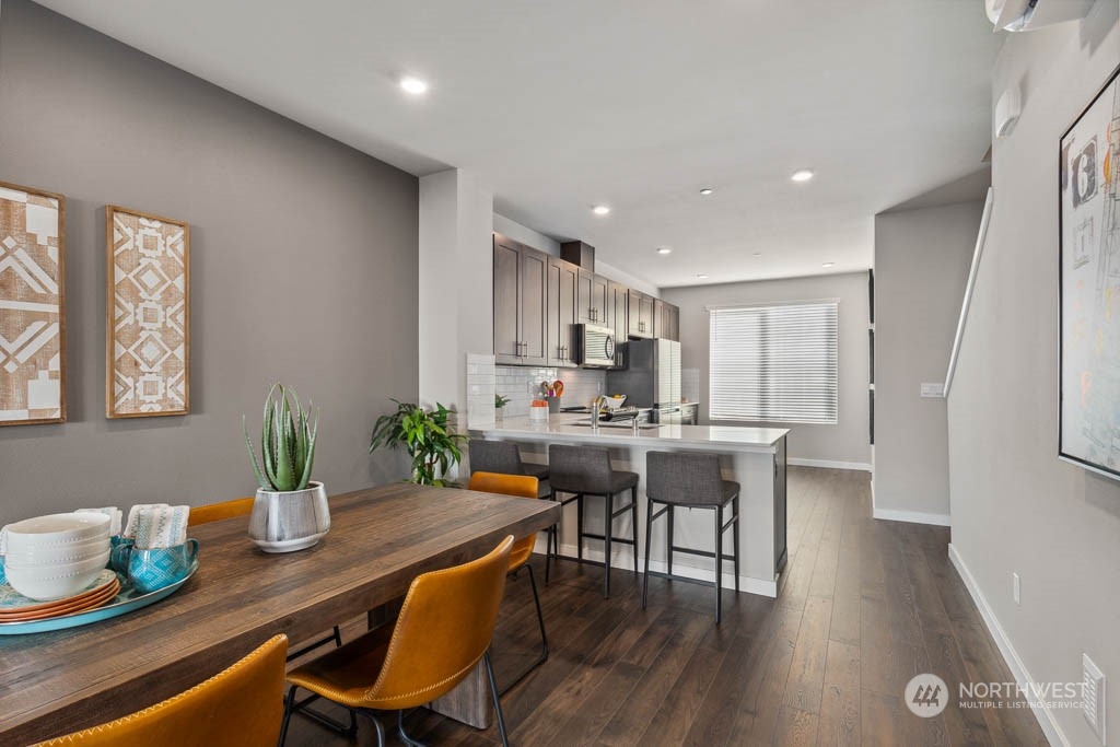 9616 19th Avenue Southeast, Unit E Everett, WA 98208 - Photo 5 of 17 a kitchen with a table and chairs in it