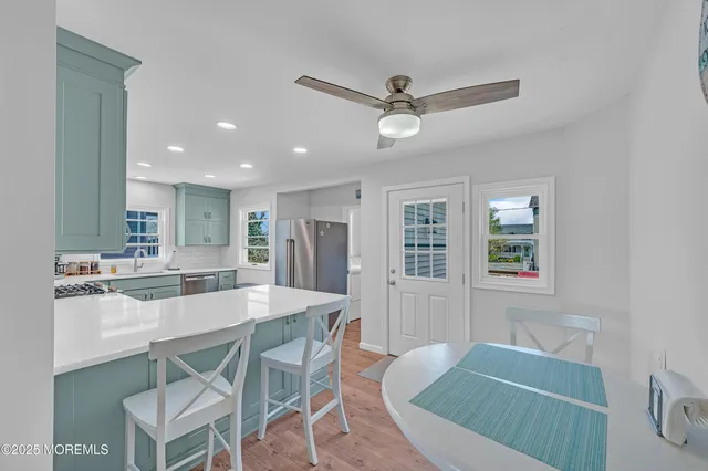 a view of backyard with patio