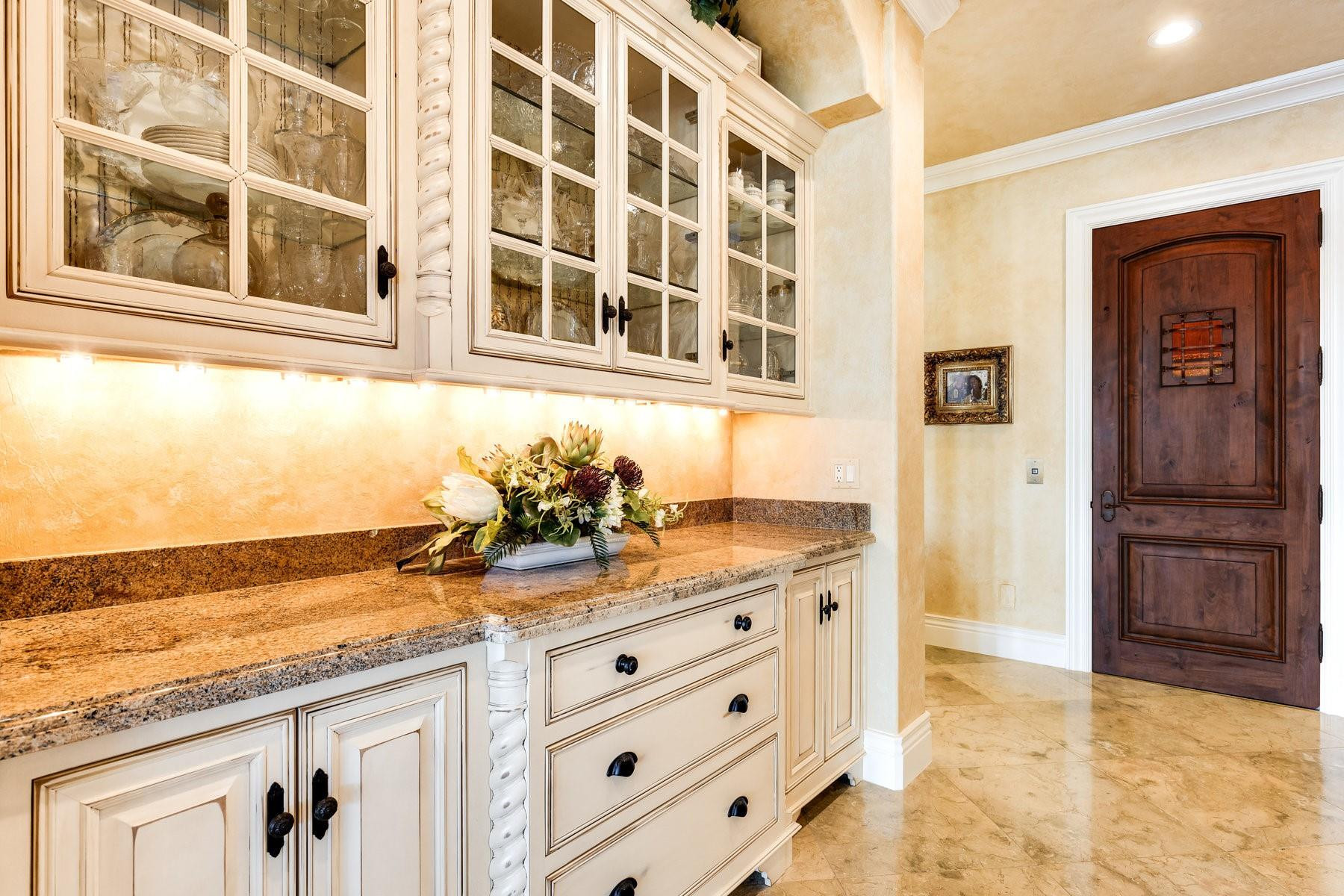 4089 Southeast Old St Lucie Boulevard Stuart, FL 34996 - Photo 22 of 99 a bathroom with a granite countertop sink and a washing machine