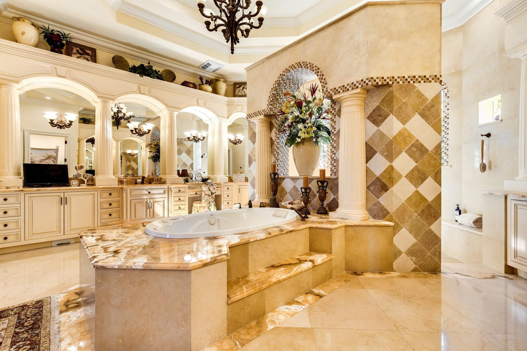 4089 Southeast Old St Lucie Boulevard Stuart, FL 34996 - Photo 40 of 99 a bathroom with a tub sink and mirror