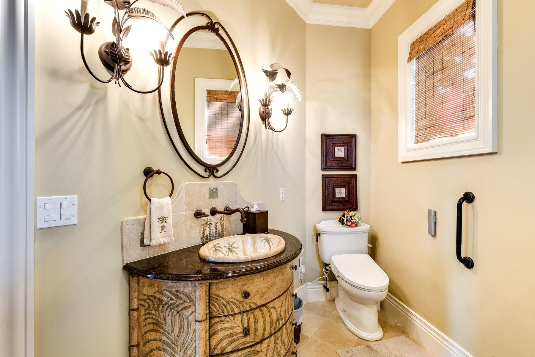 4089 Southeast Old St Lucie Boulevard Stuart, FL 34996 - Photo 46 of 99 a bathroom with a sink and a mirror