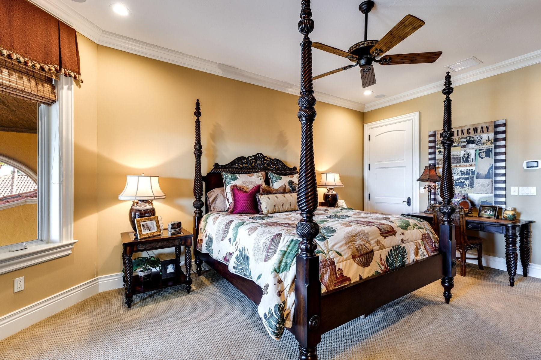 4089 Southeast Old St Lucie Boulevard Stuart, FL 34996 - Photo 73 of 99 a bed room with a bed window and a ceiling fan