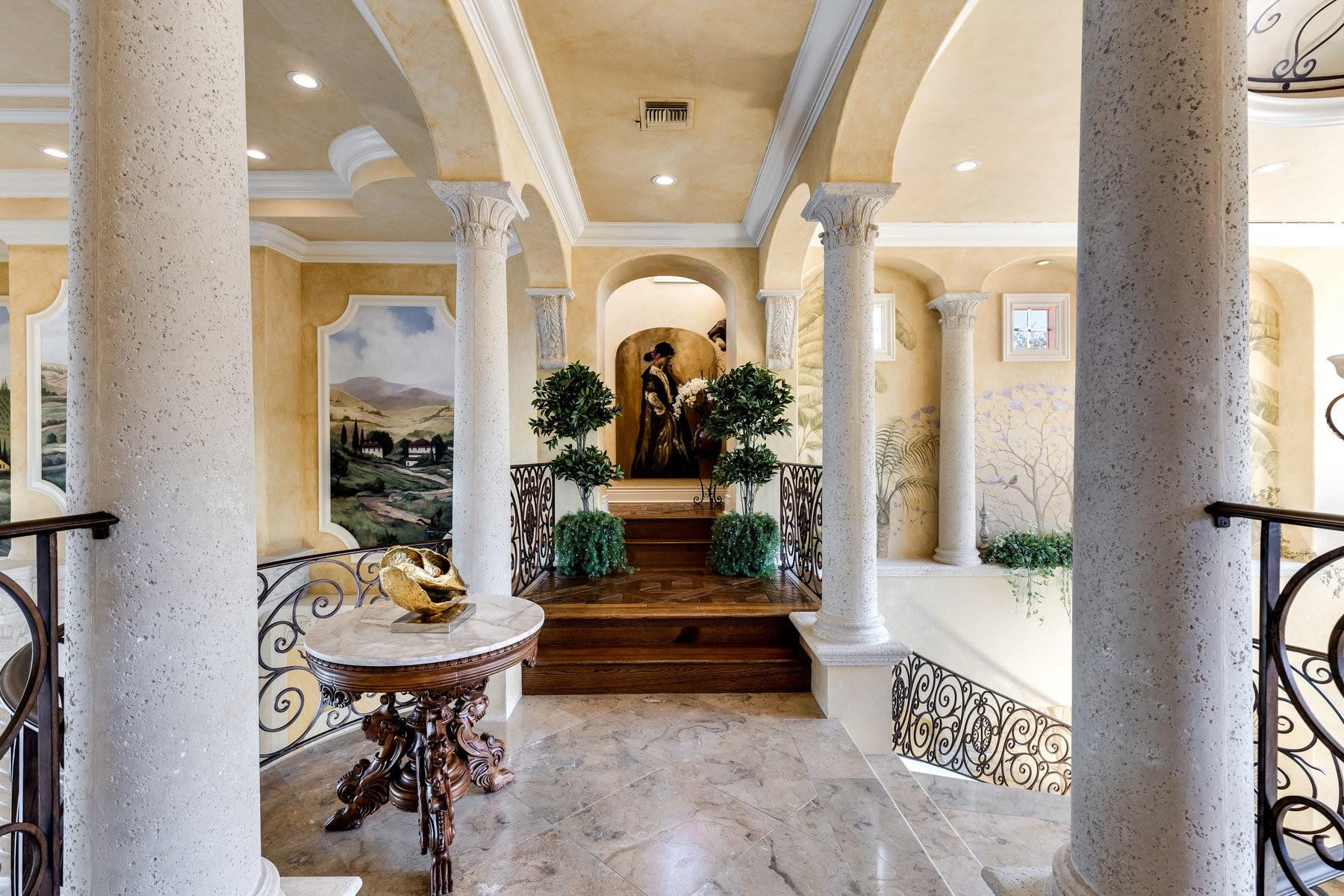 4089 Southeast Old St Lucie Boulevard Stuart, FL 34996 - Photo 76 of 99 a view of a hallway and a dining room with furniture window and wooden floor