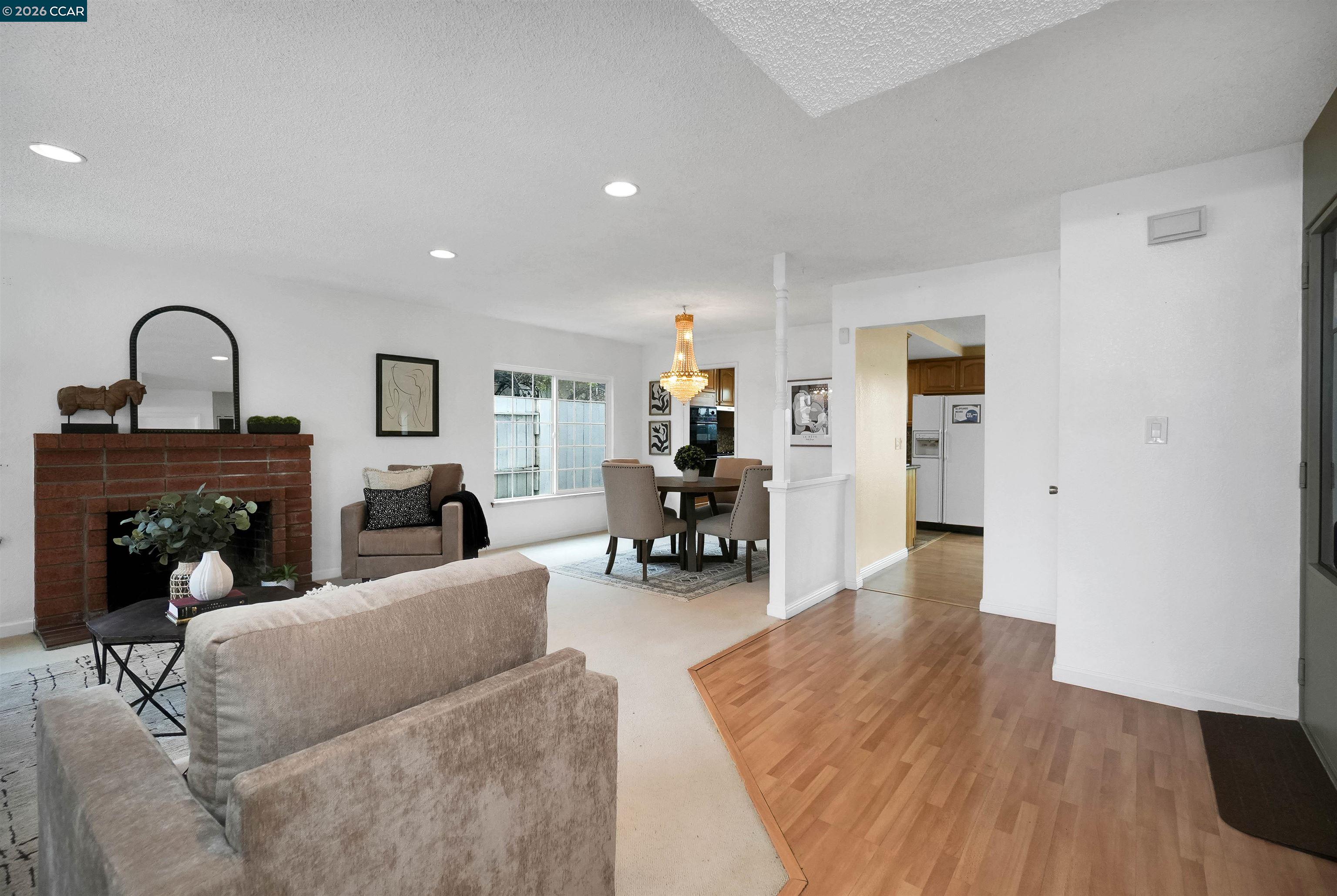 922 Coral Drive Rodeo, CA 94572 - Photo 11 of 59 a living room with furniture and a fireplace