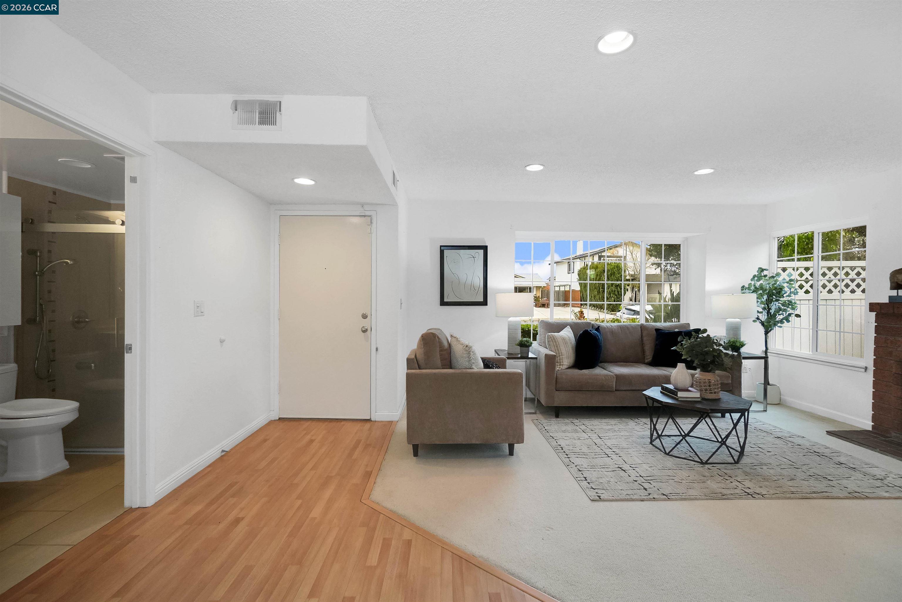 922 Coral Drive Rodeo, CA 94572 - Photo 15 of 59 a living room with furniture and a wooden floor