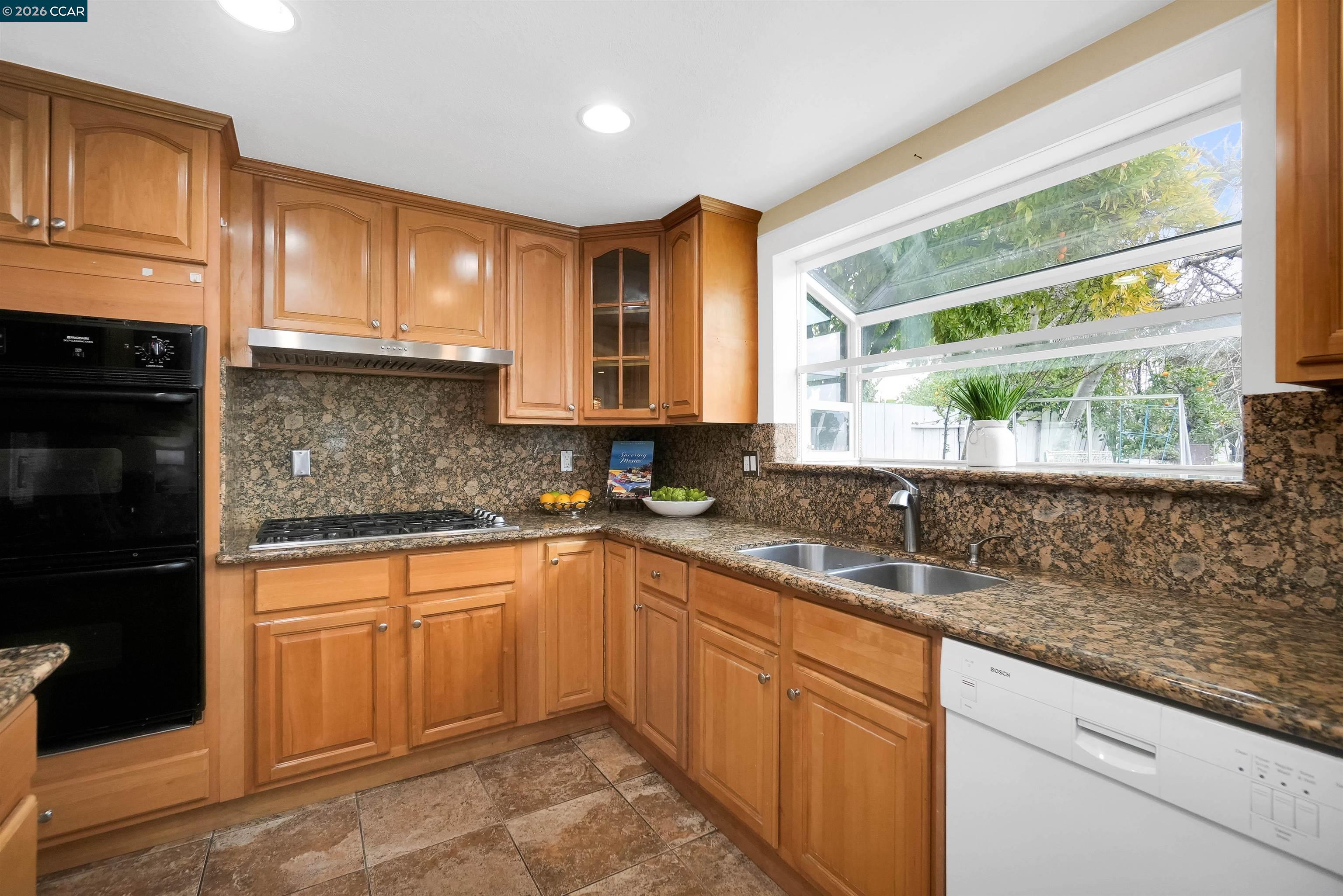922 Coral Drive Rodeo, CA 94572 - Photo 24 of 59 a kitchen with a sink stove and cabinets