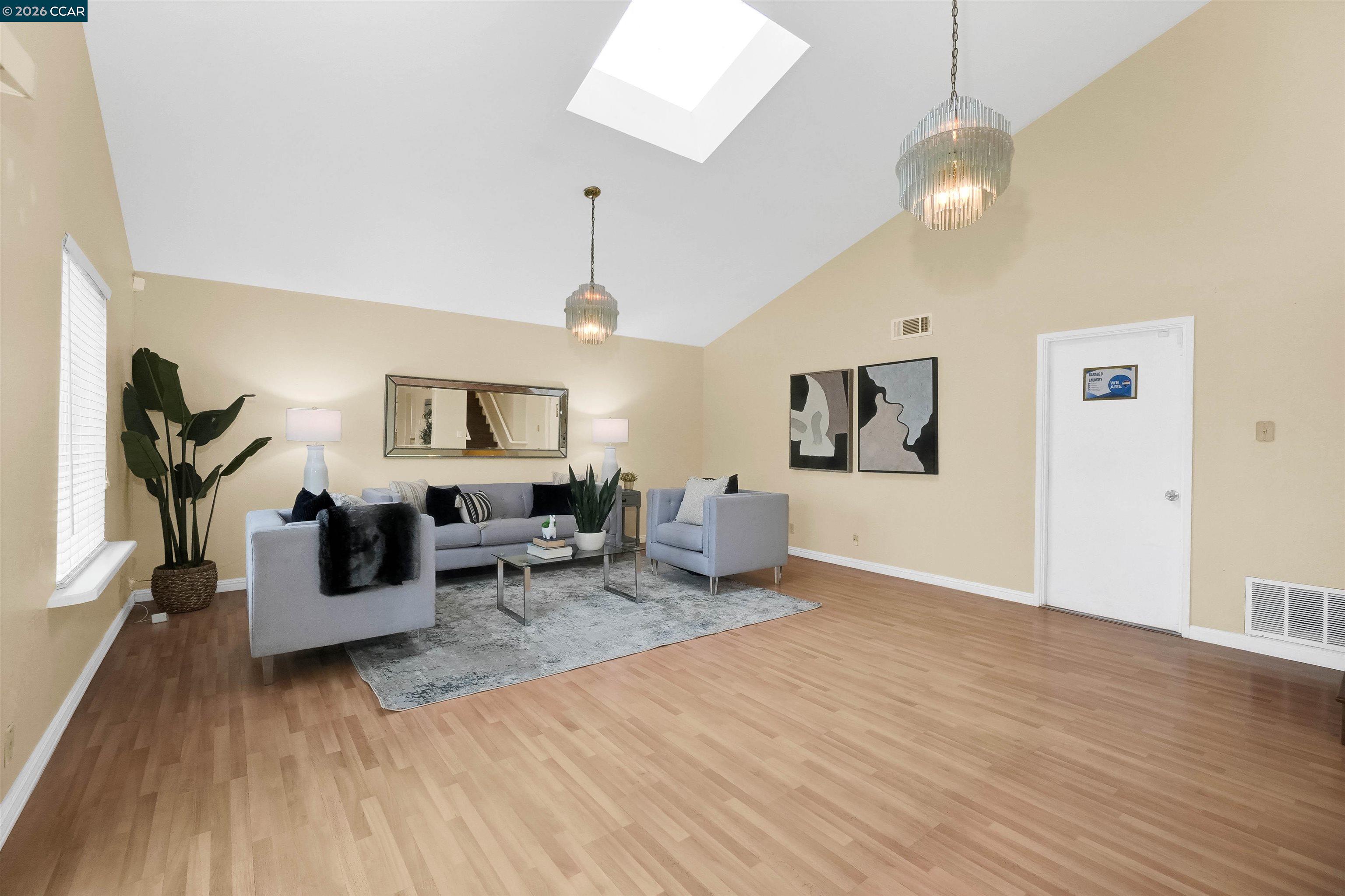 922 Coral Drive Rodeo, CA 94572 - Photo 27 of 59 a living room with furniture and wooden floor