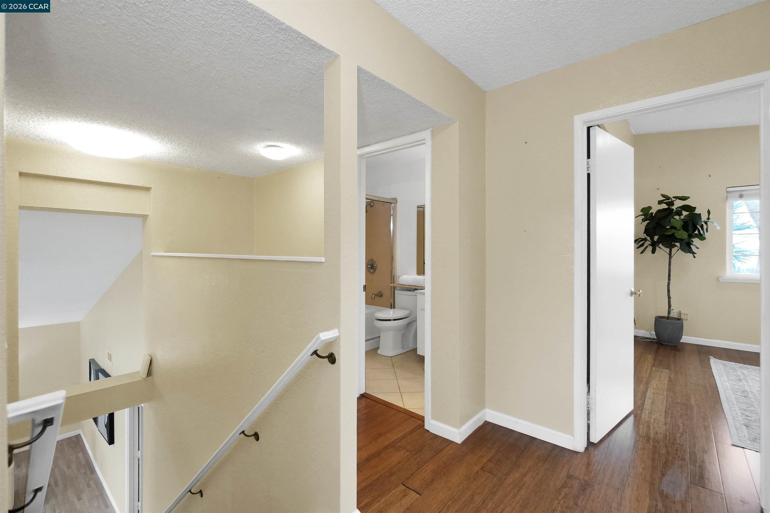922 Coral Drive Rodeo, CA 94572 - Photo 32 of 59 a view of a hallway view with wooden floor and staircase