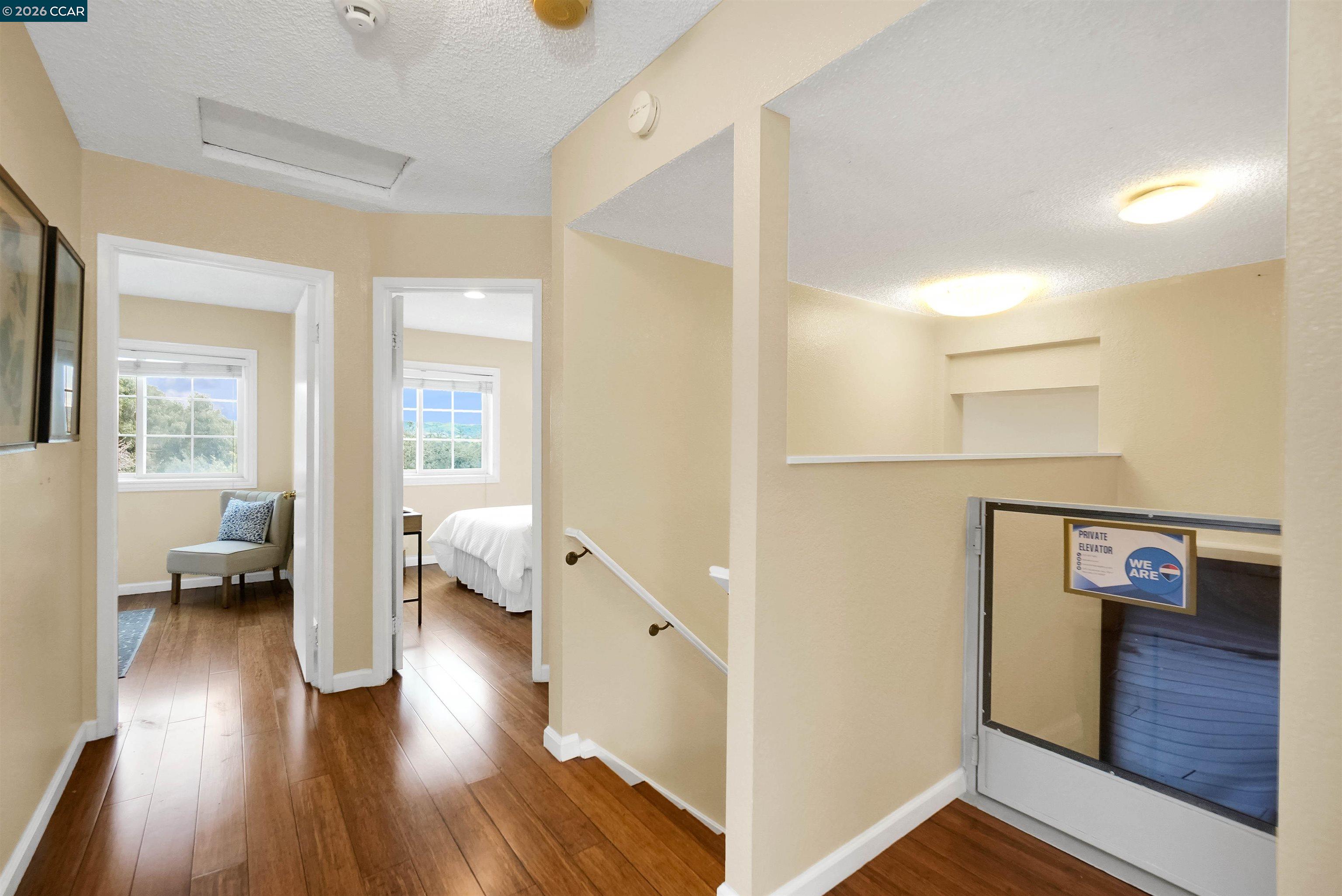 922 Coral Drive Rodeo, CA 94572 - Photo 33 of 59 a view of a hallway view with living room and wooden floor