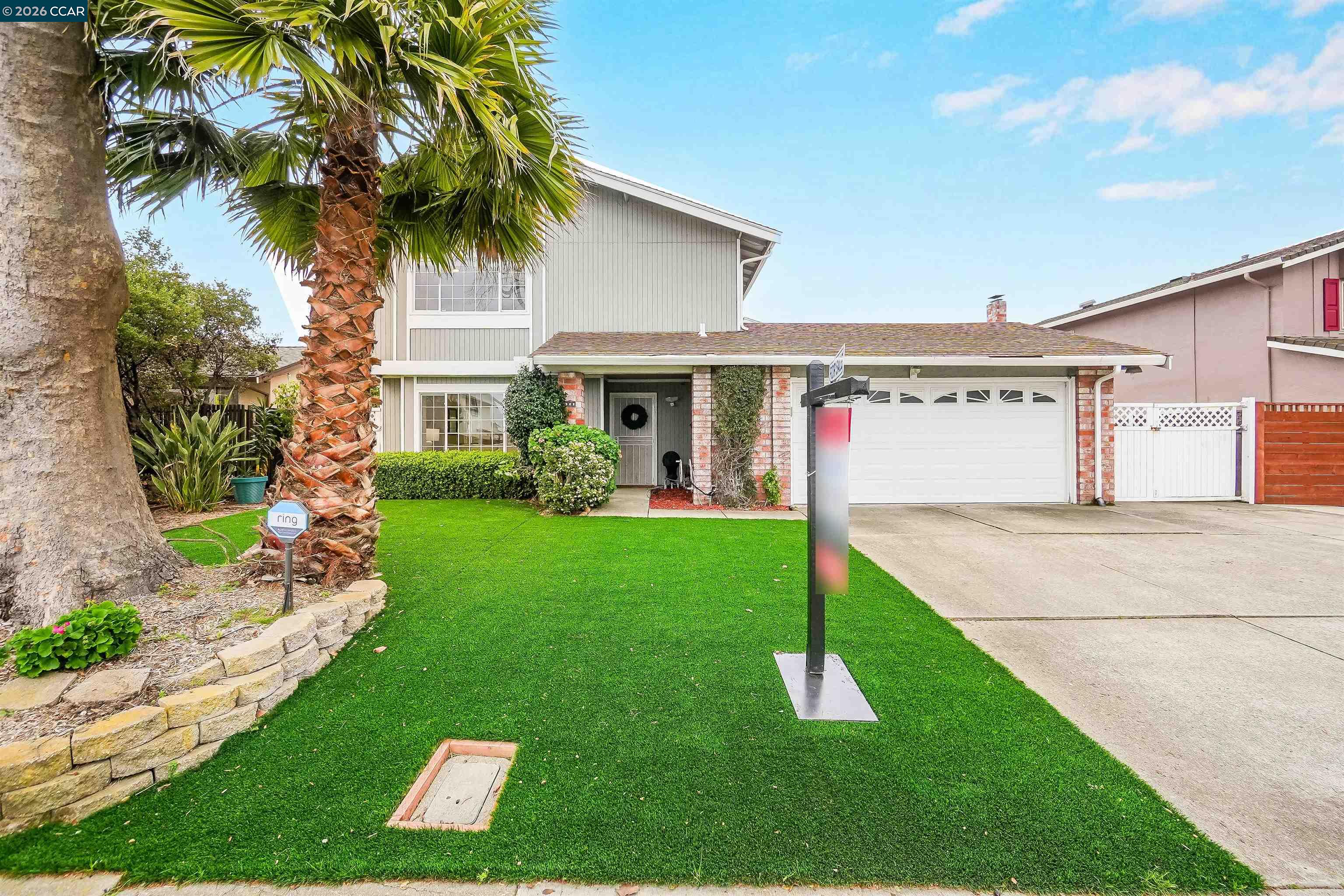 922 Coral Drive Rodeo, CA 94572 - Photo 4 of 59 a front view of a house with a yard and potted plants