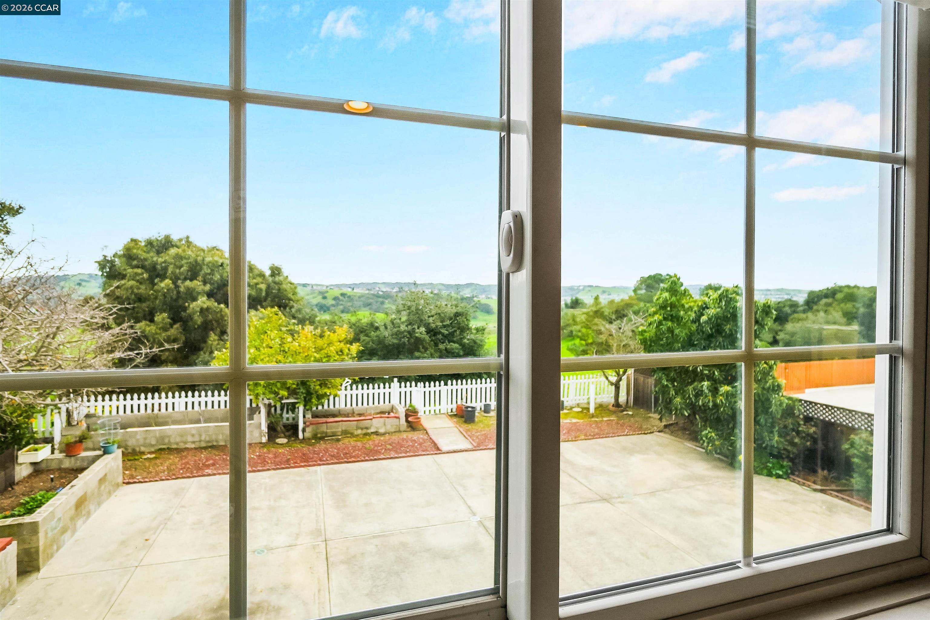 922 Coral Drive Rodeo, CA 94572 - Photo 42 of 59 a view of a glass door and an empty room with a floor to ceiling window