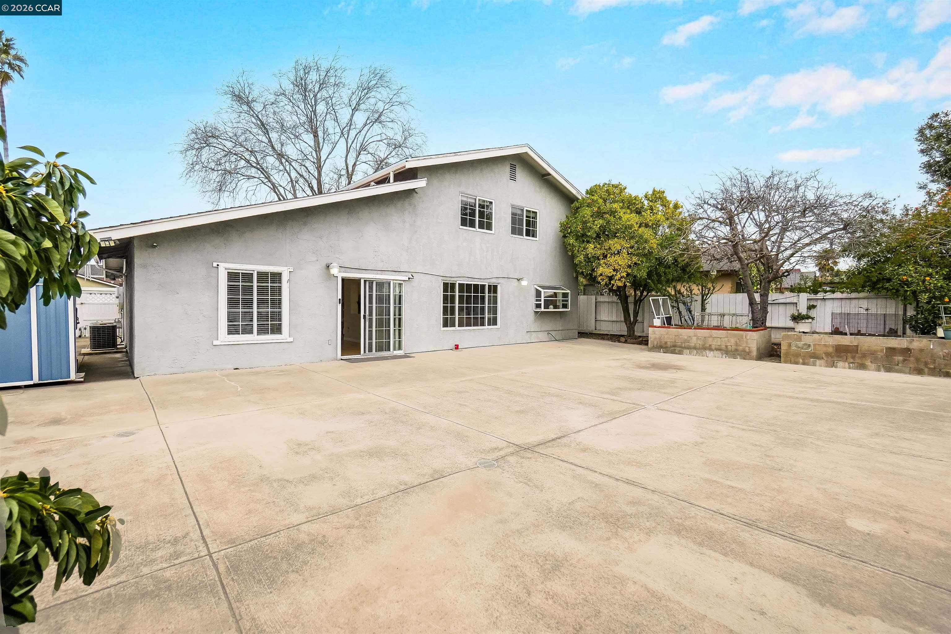 922 Coral Drive Rodeo, CA 94572 - Photo 45 of 59 a front view of a house with a yard and garage