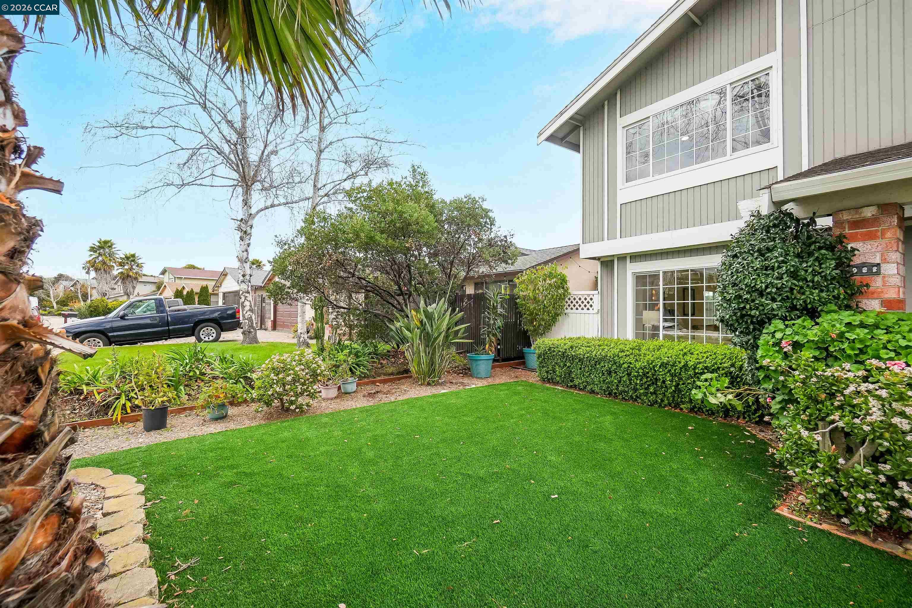 922 Coral Drive Rodeo, CA 94572 - Photo 7 of 59 a view of a house with a yard and potted plants
