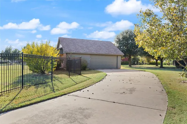 a view of a backyard that has a tree