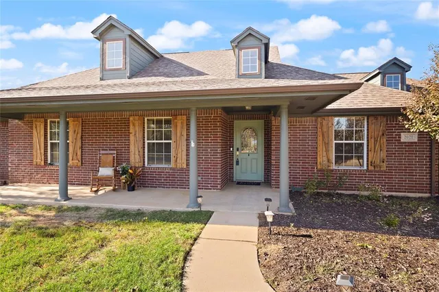 a view of a house with sitting area
