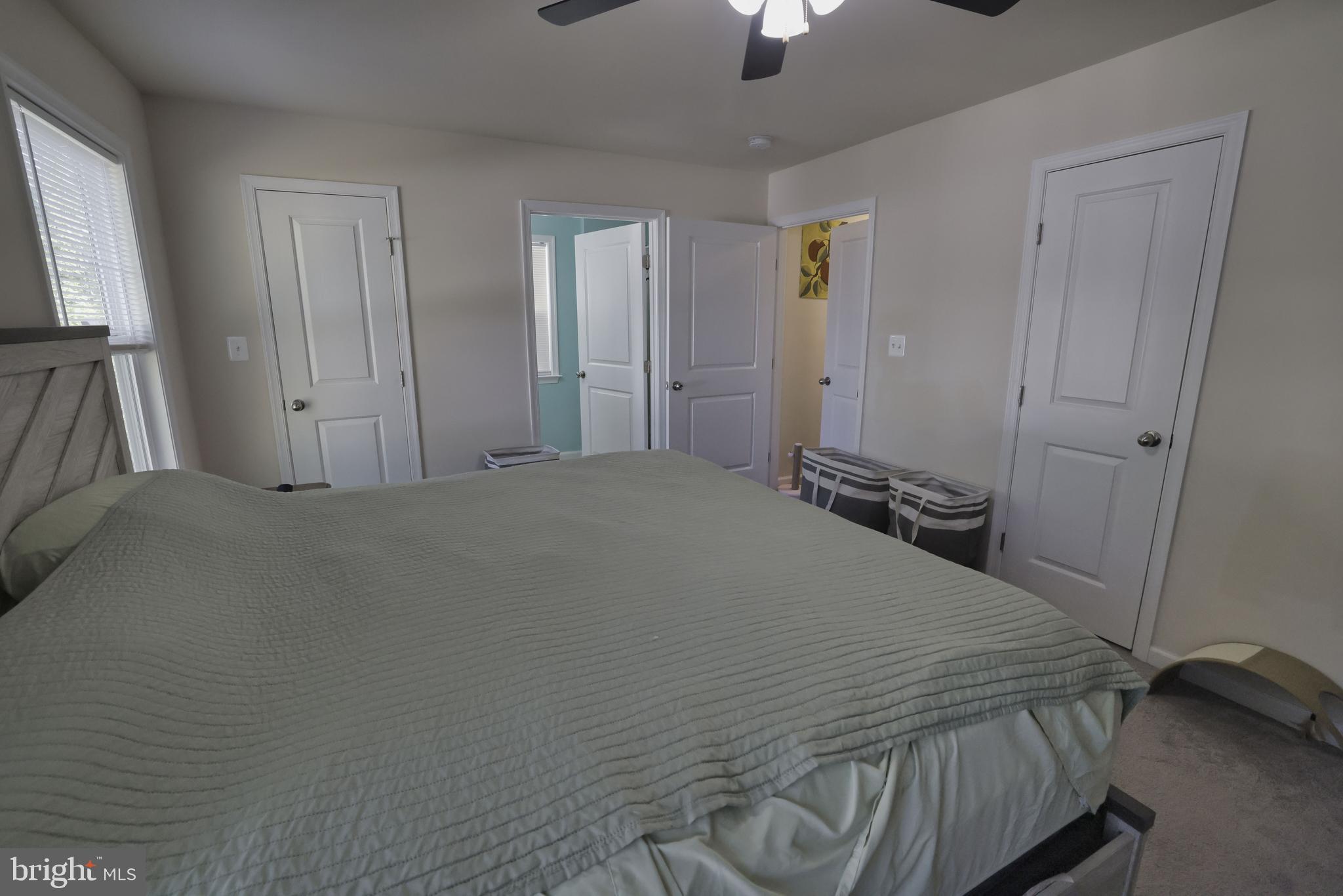 48 Rustic Lane Colonial Beach, VA 22443 - Photo 39 of 47 a bedroom with a bed and a flat tv screen
