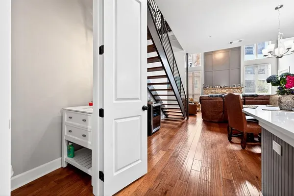 a view of a livingroom with furniture and hardwood floor