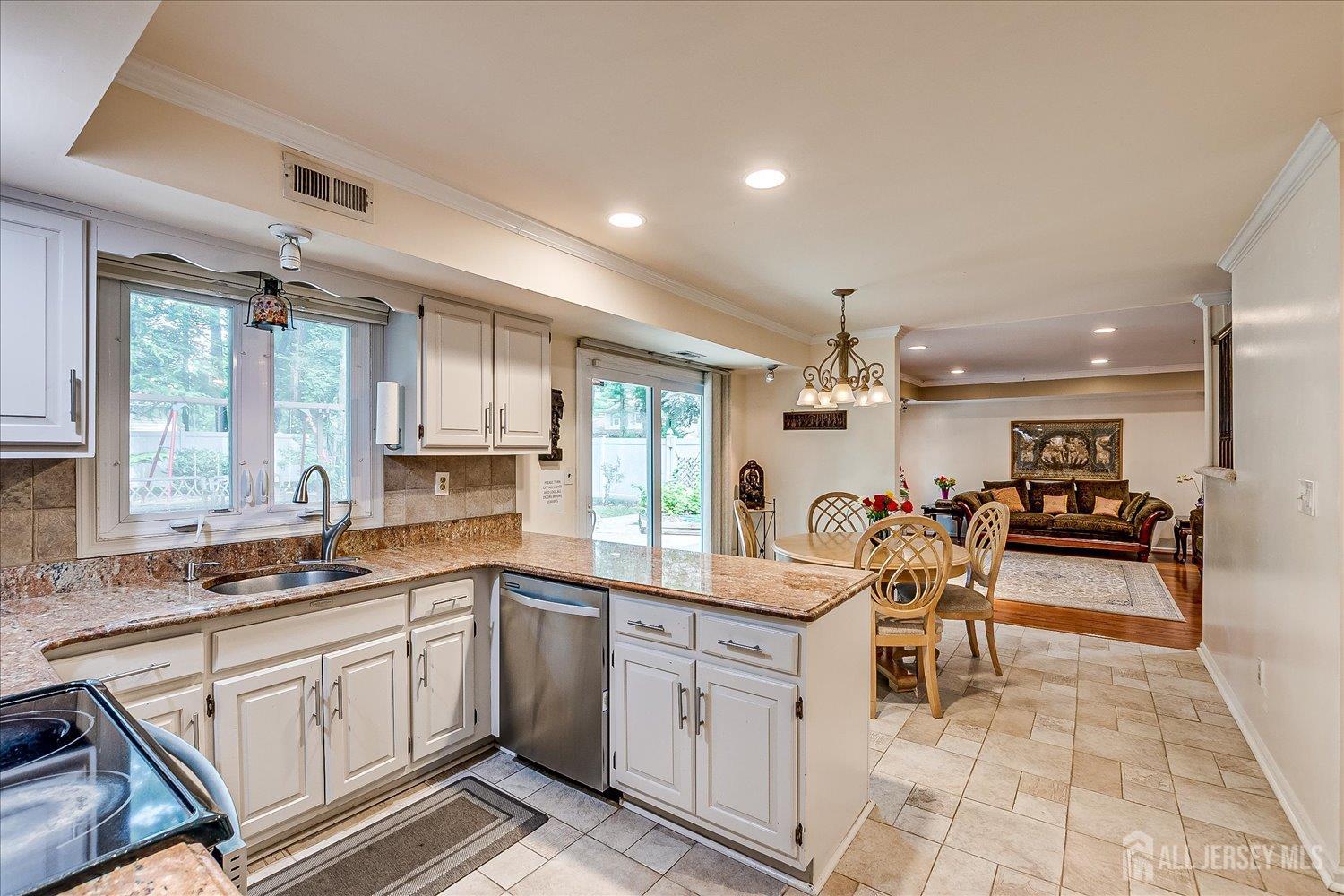 2 Pine Ridge Drive Edison, NJ 08820 - Photo 16 of 50 a large white kitchen with a sink and cabinets