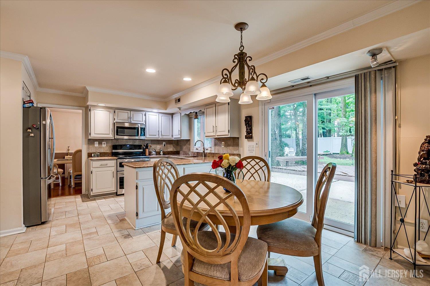 2 Pine Ridge Drive Edison, NJ 08820 - Photo 19 of 50 a view of a dining room with furniture window and outside view