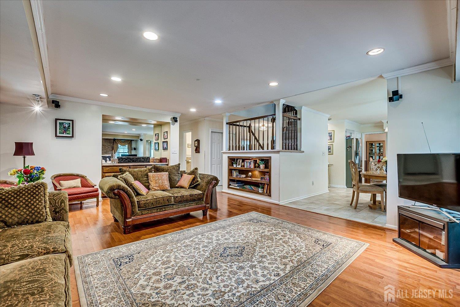 2 Pine Ridge Drive Edison, NJ 08820 - Photo 20 of 50 a living room with furniture and a flat screen tv