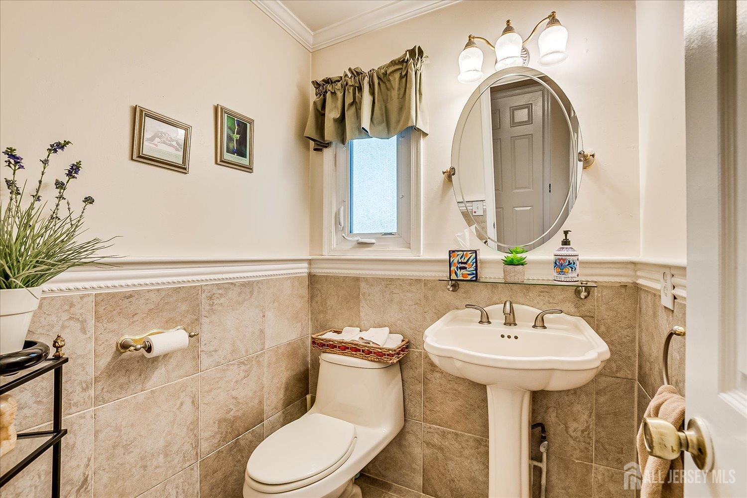 2 Pine Ridge Drive Edison, NJ 08820 - Photo 26 of 50 a bathroom with a sink and mirror with toilet