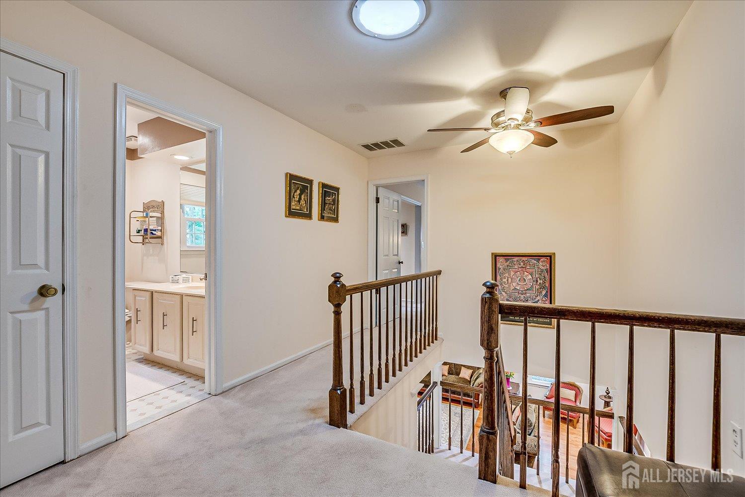 2 Pine Ridge Drive Edison, NJ 08820 - Photo 28 of 50 a view of a hallway with windows and ceiling fan