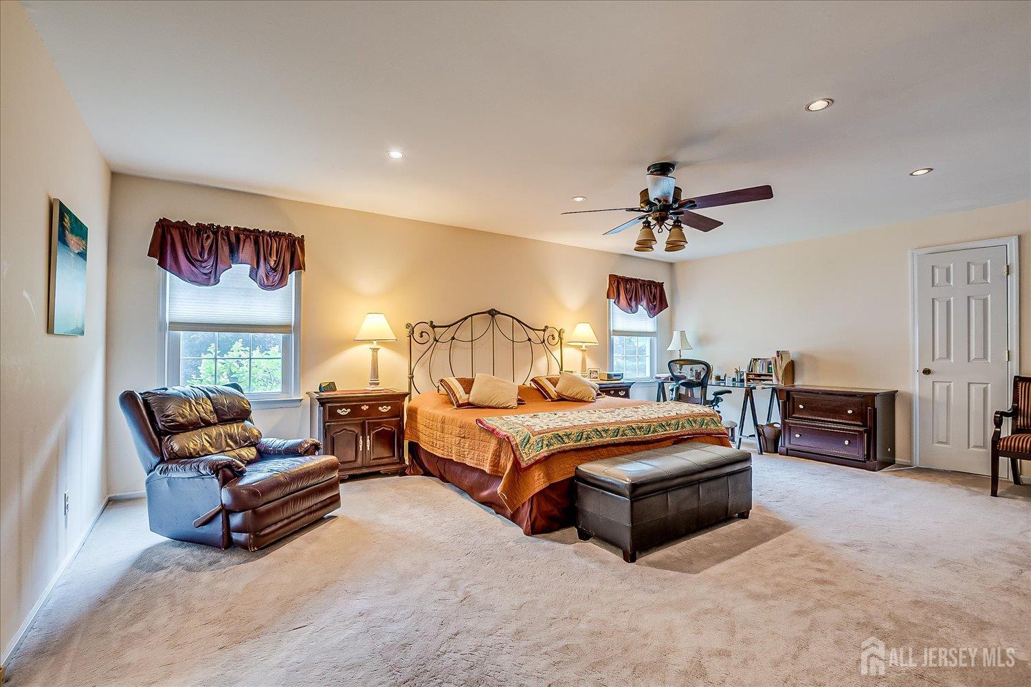 2 Pine Ridge Drive Edison, NJ 08820 - Photo 29 of 50 a spacious bedroom with a bed and a chandelier