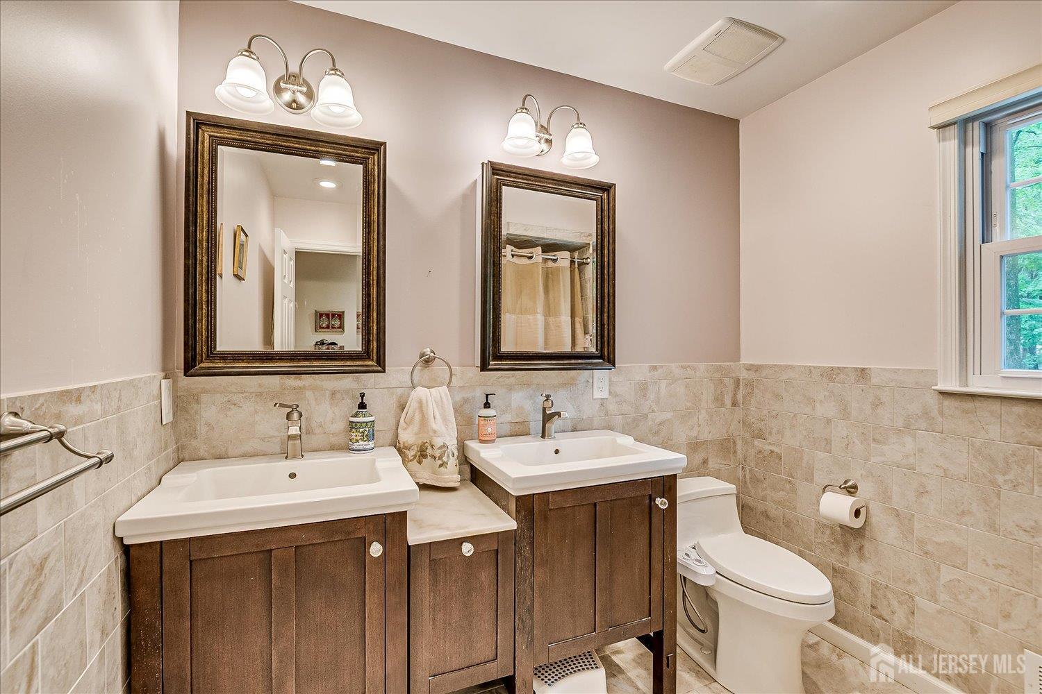2 Pine Ridge Drive Edison, NJ 08820 - Photo 31 of 50 a bathroom with a toilet sink and mirror