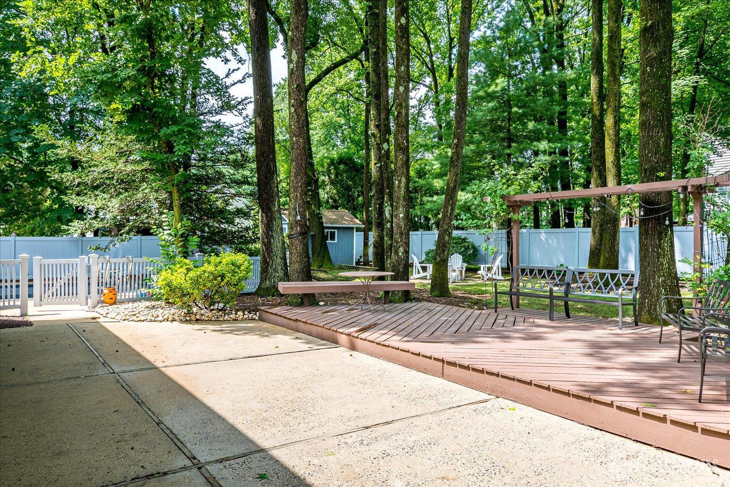 2 Pine Ridge Drive Edison, NJ 08820 - Photo 40 of 50 a view of a patio with a chairs and table in the patio