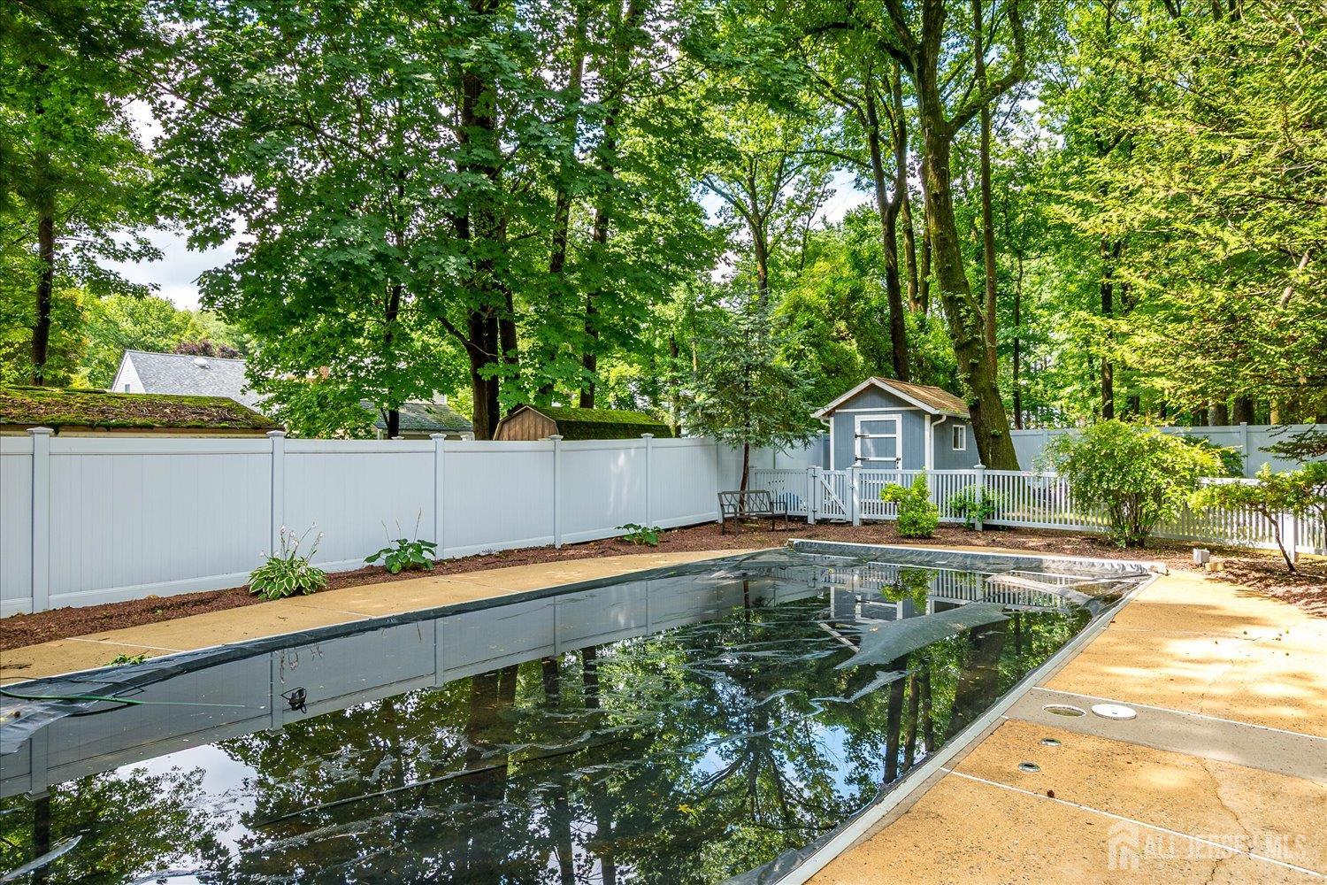2 Pine Ridge Drive Edison, NJ 08820 - Photo 42 of 50 a front view of a house with garden