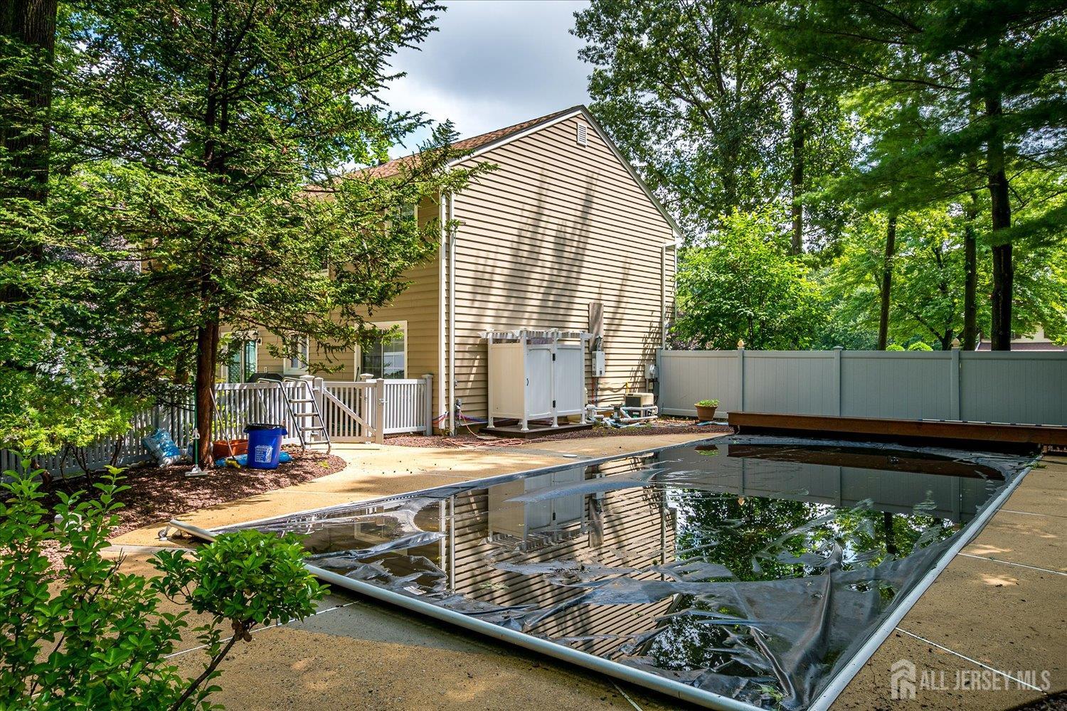 2 Pine Ridge Drive Edison, NJ 08820 - Photo 46 of 50 a view of a backyard with a large pool and sitting area