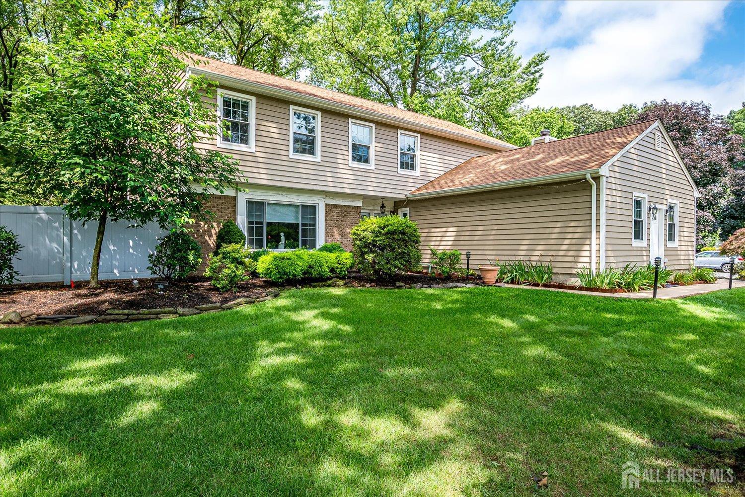 2 Pine Ridge Drive Edison, NJ 08820 - Photo 5 of 50 a front view of house with yard and green space