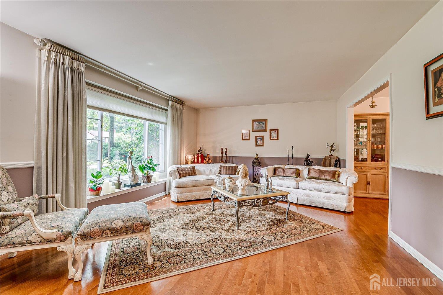 2 Pine Ridge Drive Edison, NJ 08820 - Photo 9 of 50 a living room with furniture and a large window