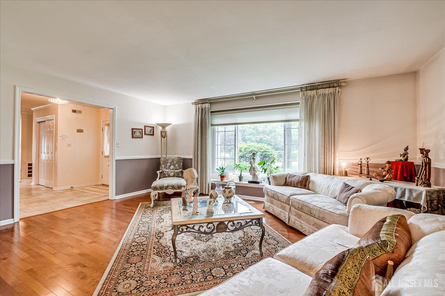 2 Pine Ridge Drive Edison, NJ 08820 - Photo 10 of 50 a living room with furniture and a large window