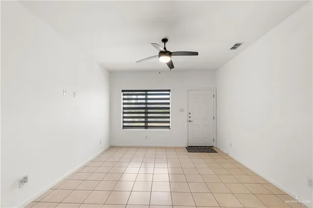 a view of empty room with windows