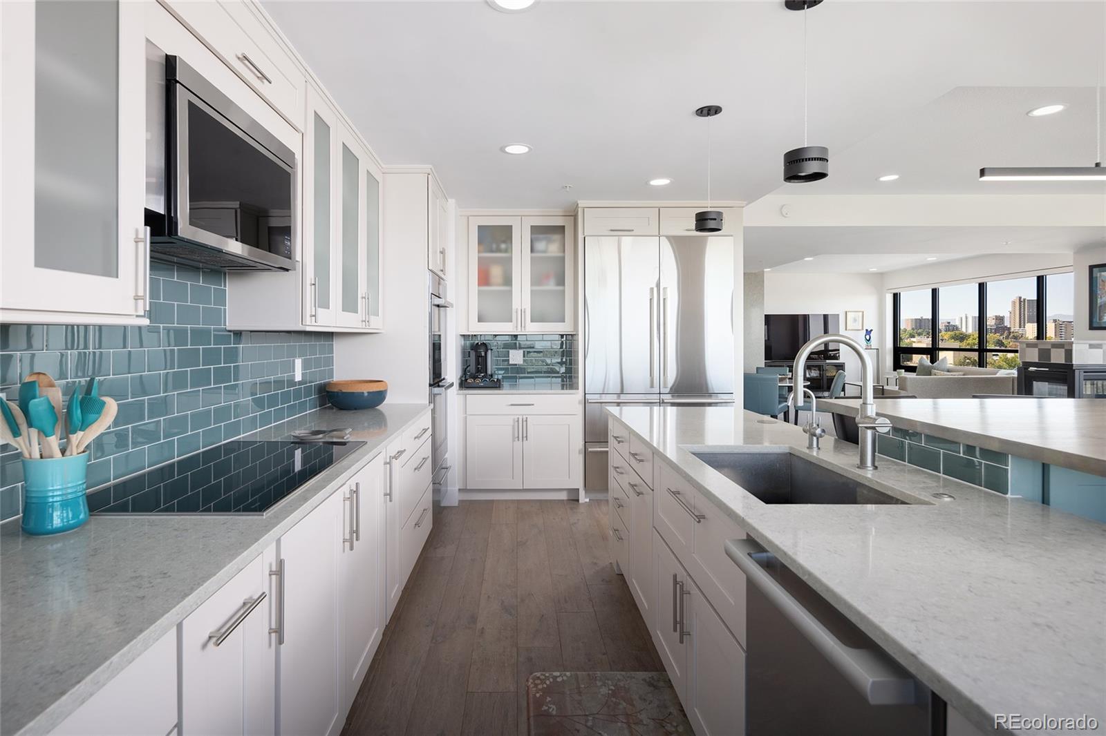 1650 Fillmore Street, Unit 1107 Denver, CO 80206 - Photo 15 of 49 a large kitchen with stainless steel appliances lots of counter space and a sink