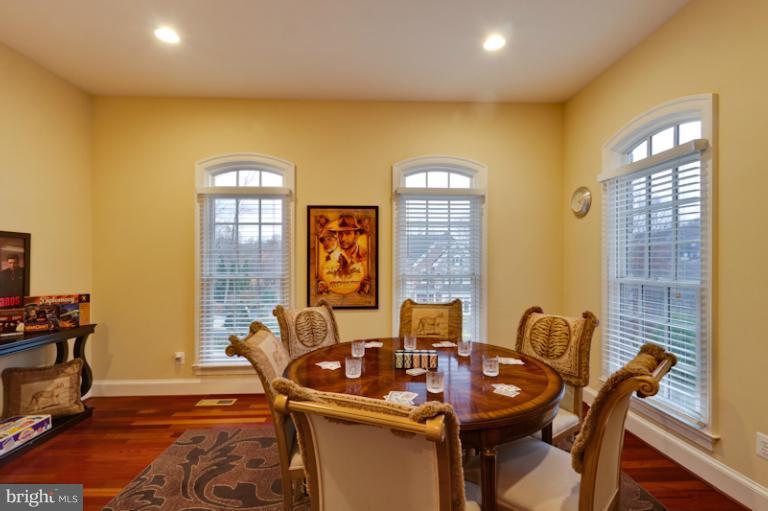 903 Georgetown Ridge Court McLean, VA 22102 - Photo 12 of 27 a view of a dining room with furniture and wooden floor