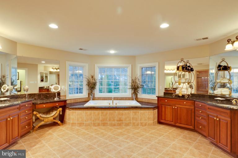 903 Georgetown Ridge Court McLean, VA 22102 - Photo 13 of 27 a living room filled with furniture and a large window