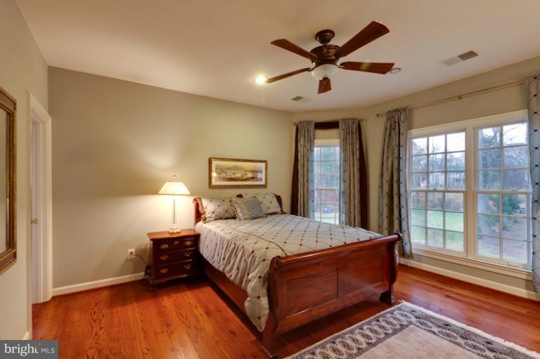 903 Georgetown Ridge Court McLean, VA 22102 - Photo 14 of 27 a bedroom with a bed and window