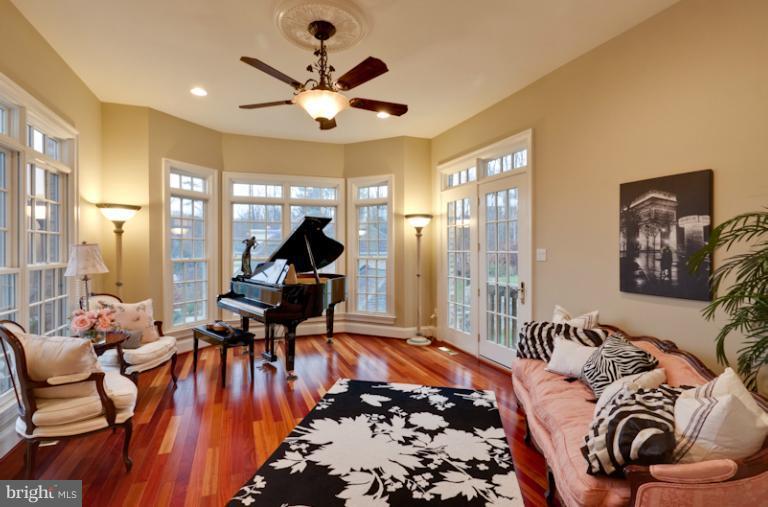 903 Georgetown Ridge Court McLean, VA 22102 - Photo 18 of 27 a bed room with furniture and a chandelier