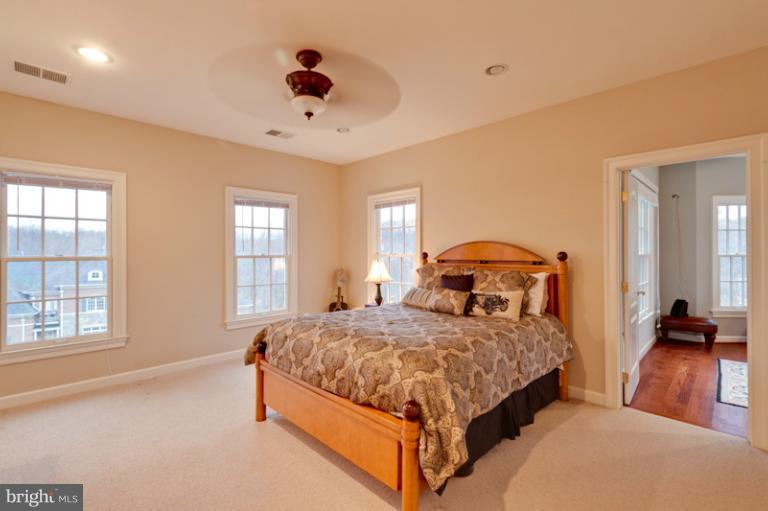 903 Georgetown Ridge Court McLean, VA 22102 - Photo 21 of 27 a bedroom with a bed and window