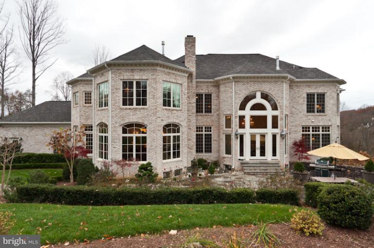903 Georgetown Ridge Court McLean, VA 22102 - Photo 23 of 27 a front view of a house with a yard