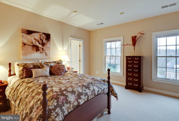 903 Georgetown Ridge Court McLean, VA 22102 - Photo 5 of 27 a bedroom with a bed a dresser and a window