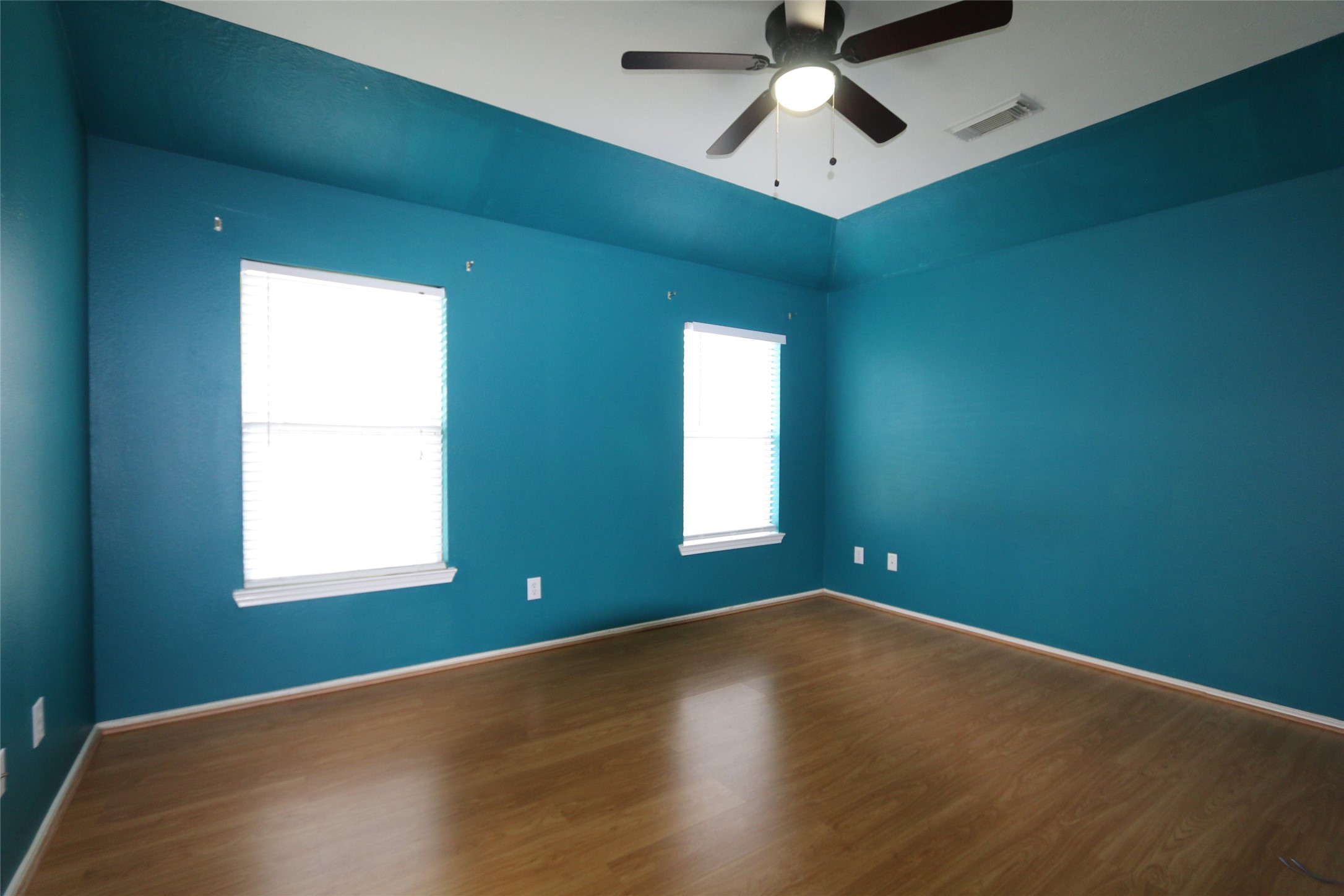 5914 Ridgebriar Lane Houston, TX 77085 - Photo 4 of 8 a view of empty room with ceiling fan and window