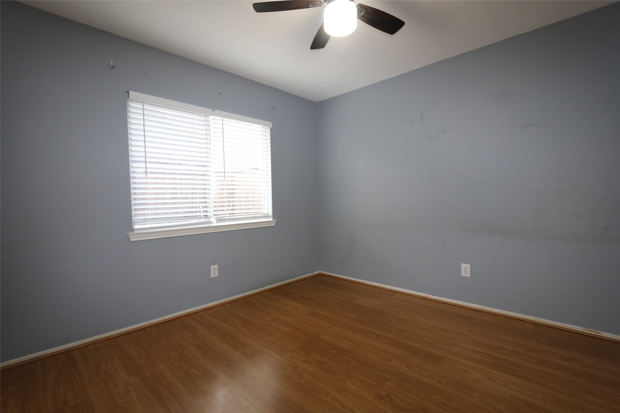 5914 Ridgebriar Lane Houston, TX 77085 - Photo 7 of 8 an empty room with a window