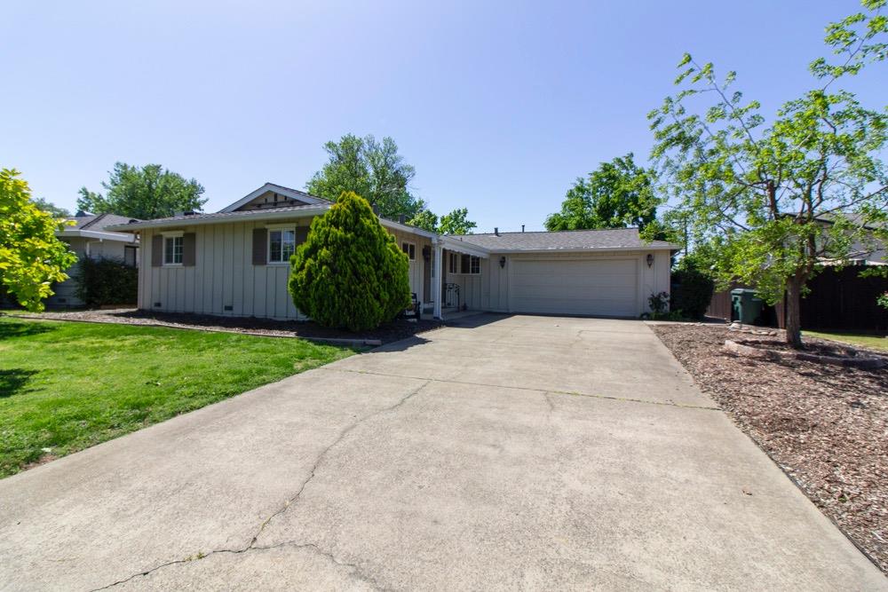 5118 Boyd Drive Carmichael, CA 95608 - Photo 1 of 1 a front view of a house with a yard and potted plants