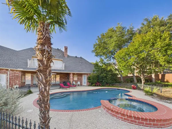 a swimming pool with outdoor seating yard and barbeque oven